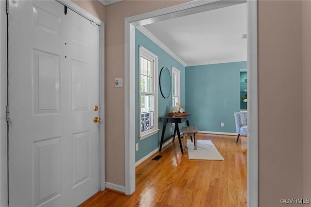 6730 Bryanbell Dr, North Chesterfield, VA 23234 - entrance foyer with crown molding, light wood finished floors, and baseboards