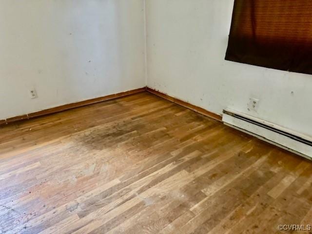 25468 Woodland Park Cir, Courtland, VA 23837 - empty room featuring wood-type flooring and baseboards