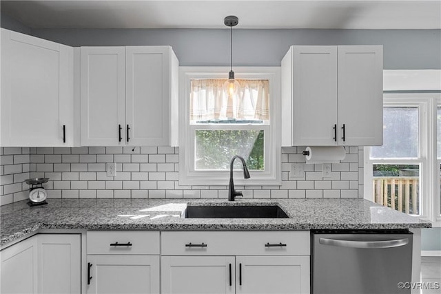 1409 Sycamore Ridge Ct, Midlothian, VA 23114 - kitchen featuring dishwasher, a sink, white cabinetry, and decorative backsplash