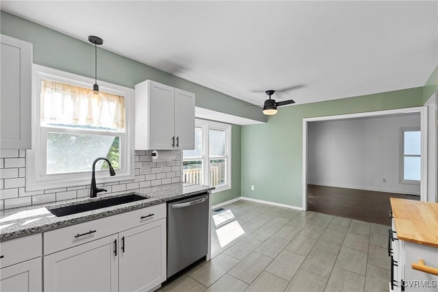 1409 Sycamore Ridge Ct, Midlothian, VA 23114 - kitchen with dishwasher, a sink, wood counters, backsplash, and white cabinets