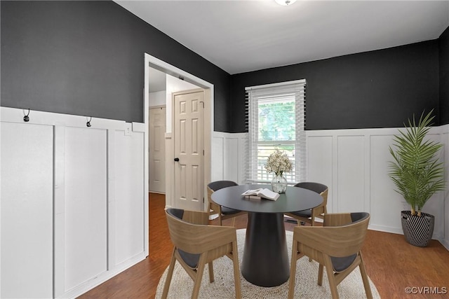 1409 Sycamore Ridge Ct, Midlothian, VA 23114 - dining room featuring a decorative wall, a wainscoted wall, and wood finished floors