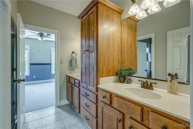 3330 Handley Rd, Midlothian, VA 23113 - bathroom with vanity, marble look tiles, ceiling fan, a chandelier, and baseboards