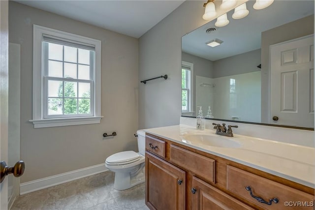 3330 Handley Rd, Midlothian, VA 23113 - full bathroom with baseboards, toilet, vanity, and a shower