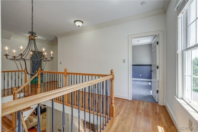 3330 Handley Rd, Midlothian, VA 23113 - hall with an upstairs landing, a chandelier, ornamental molding, light wood-type flooring, and baseboards