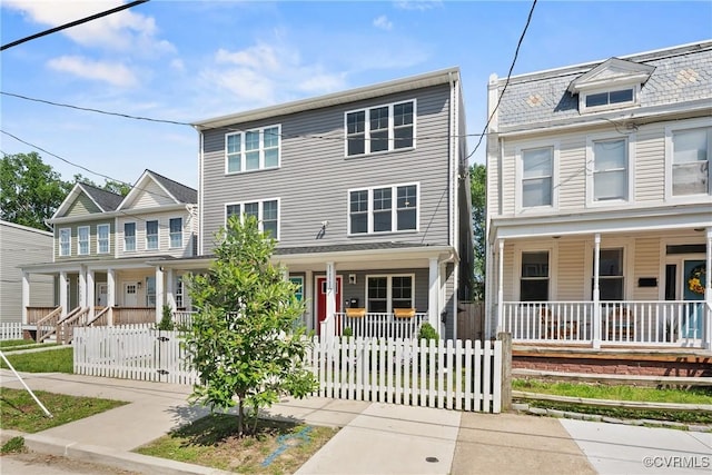 1117 N 31st St, Richmond, VA 23223 - view of property with covered porch and a fenced front yard