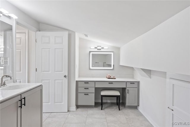 1117 N 31st St, Richmond, VA 23223 - bathroom featuring vaulted ceiling, vanity, and tile patterned flooring