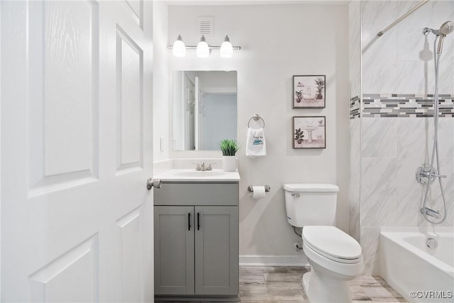 1117 N 31st St, Richmond, VA 23223 - full bath featuring vanity,  shower combination, and wood finished floors