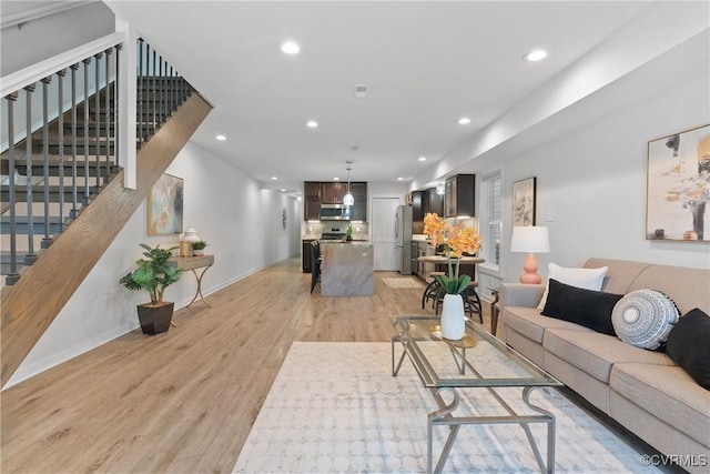 1117 N 31st St, Richmond, VA 23223 - living area with light wood-type flooring, stairs, and recessed lighting