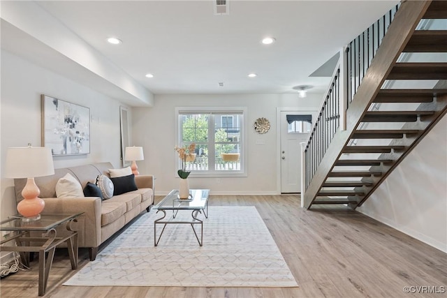 1117 N 31st St, Richmond, VA 23223 - living area with stairs, wood finished floors, and recessed lighting