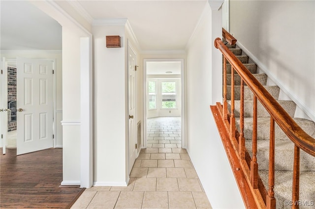 9645 Benbow Rd, North Chesterfield, VA 23235 - hallway with crown molding, stairs, and light tile patterned floors