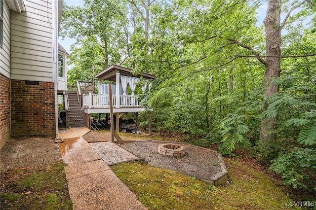 9645 Benbow Rd, North Chesterfield, VA 23235 - view of yard with stairway, an outdoor fire pit, and a wooden deck