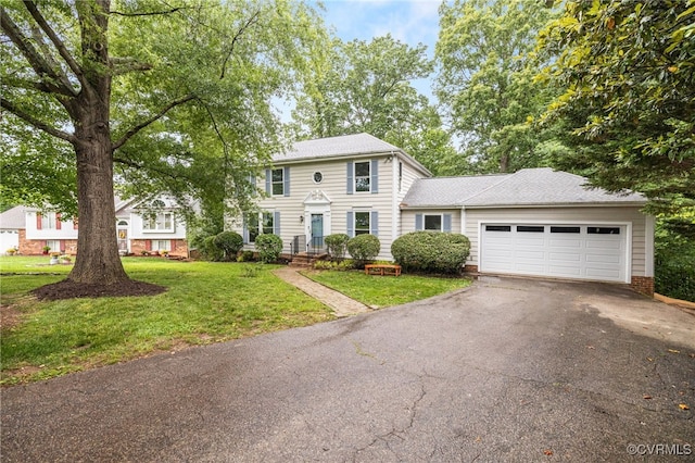 9645 Benbow Rd, North Chesterfield, VA 23235 - colonial house featuring asphalt driveway, a garage, a front lawn, and a shingled roof