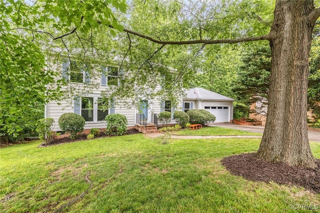 9645 Benbow Rd, North Chesterfield, VA 23235 - colonial inspired home featuring concrete driveway, an attached garage, and a front yard