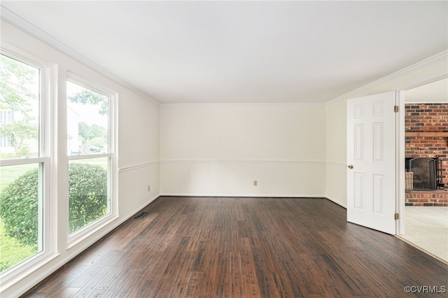 9645 Benbow Rd, North Chesterfield, VA 23235 - unfurnished living room featuring dark wood-style flooring, a fireplace, crown molding, and baseboards