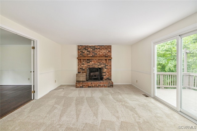 9645 Benbow Rd, North Chesterfield, VA 23235 - unfurnished living room with carpet floors, a brick fireplace, and baseboards