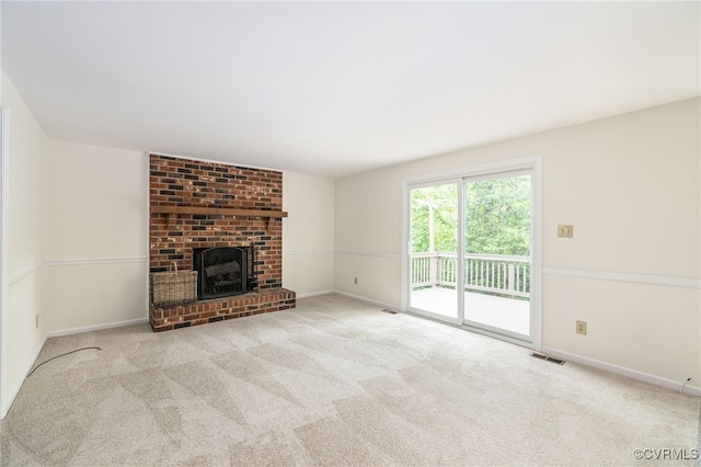 9645 Benbow Rd, North Chesterfield, VA 23235 - unfurnished living room featuring a brick fireplace, carpet flooring, and baseboards