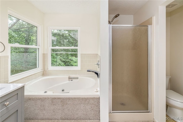 9645 Benbow Rd, North Chesterfield, VA 23235 - full bathroom with a shower stall, toilet, a whirlpool tub, and vanity