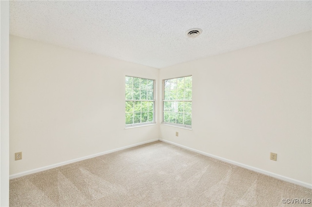 9645 Benbow Rd, North Chesterfield, VA 23235 - spare room with carpet, a textured ceiling, and baseboards