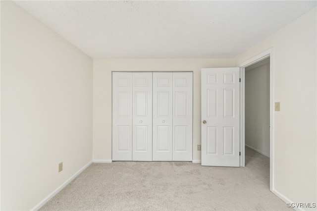 9645 Benbow Rd, North Chesterfield, VA 23235 - unfurnished bedroom featuring light colored carpet, baseboards, and a closet