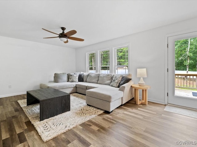11660 Oakrise Pl, New Kent, VA 23124 - living area featuring wood finished floors, ceiling fan, and baseboards