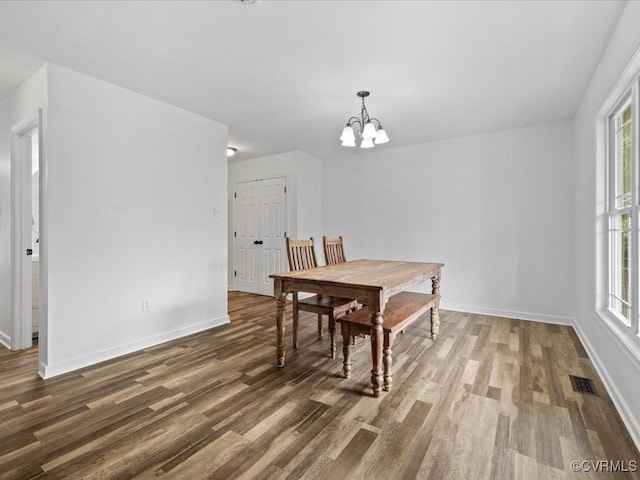 11660 Oakrise Pl, New Kent, VA 23124 - dining space featuring wood finished floors, a chandelier, and baseboards