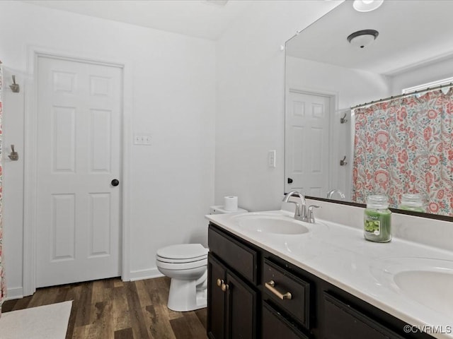 11660 Oakrise Pl, New Kent, VA 23124 - full bath with double vanity, wood finished floors, toilet, and a shower with shower curtain