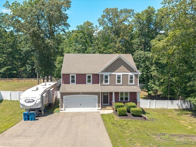 11660 Oakrise Pl, New Kent, VA 23124 - view of front of home featuring driveway, an attached garage, and roof with shingles
