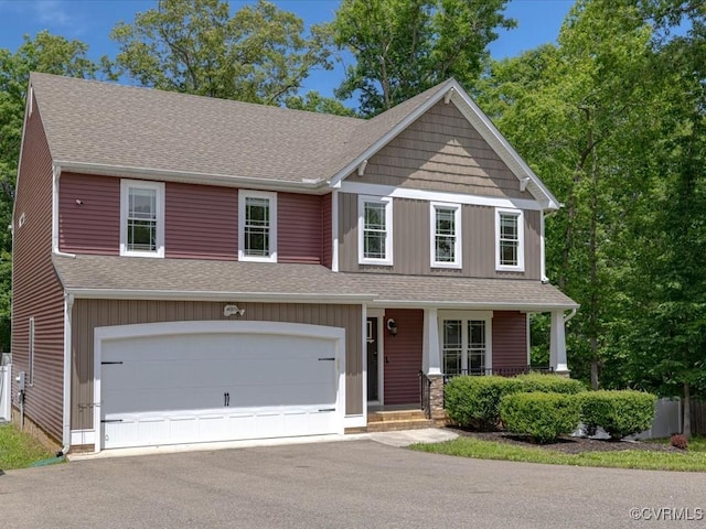 11660 Oakrise Pl, New Kent, VA 23124 - view of front of house with a porch, asphalt driveway, a garage, and roof with shingles