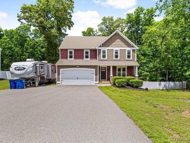 11660 Oakrise Pl, New Kent, VA 23124 - view of front of home featuring an attached garage, asphalt driveway, a porch, and roof with shingles