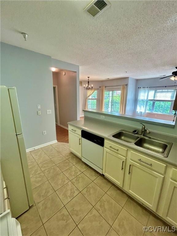 820 Brassie Ln Unit B, Glen Allen, VA 23059 - kitchen featuring white appliances, a sink, light tile patterned floors, a chandelier, and a ceiling fan