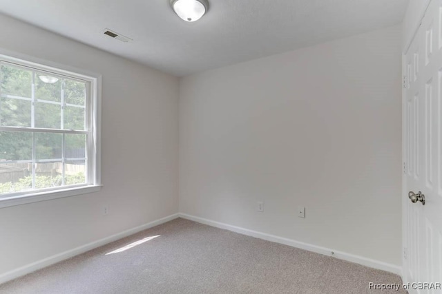 1928 Box St, Hampton, VA 23661 - empty room featuring light colored carpet, healthy amount of natural light, and baseboards
