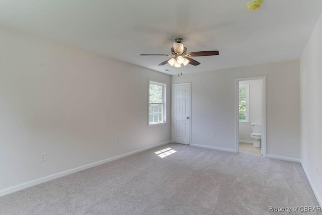 1928 Box St, Hampton, VA 23661 - unfurnished bedroom featuring light colored carpet, baseboards, ensuite bathroom, and a ceiling fan