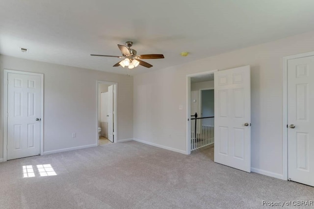 1928 Box St, Hampton, VA 23661 - unfurnished bedroom with light colored carpet, baseboards, and a ceiling fan