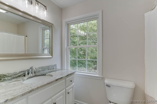1928 Box St, Hampton, VA 23661 - bathroom featuring plenty of natural light, vanity, toilet, and baseboards