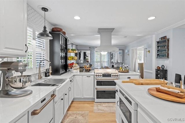 905 Manakin Rd, Midlothian, VA 23113 - kitchen with range with two ovens, built in microwave, a sink, light countertops, and ornamental molding
