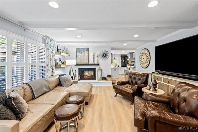 905 Manakin Rd, Midlothian, VA 23113 - living room featuring beamed ceiling, light wood-style floors, a glass covered fireplace, and recessed lighting