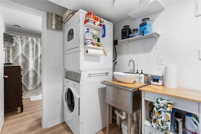 905 Manakin Rd, Midlothian, VA 23113 - laundry room with estacked washer and dryer and light wood-style floors