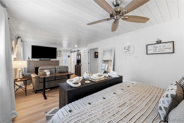 905 Manakin Rd, Midlothian, VA 23113 - bedroom featuring crown molding, light wood finished floors, a barn door, ceiling fan, and wood ceiling