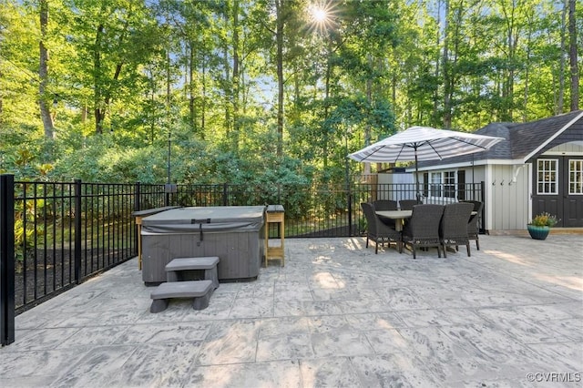 905 Manakin Rd, Midlothian, VA 23113 - fenced backyard featuring a hot tub, a patio, outdoor dining space, and an outdoor structure