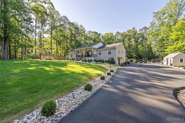 905 Manakin Rd, Midlothian, VA 23113 - view of front facade featuring asphalt driveway, a front yard, view of wooded area, and stairs