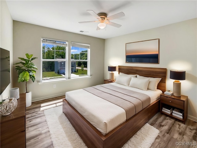 5812 Olas Ct, Richmond, VA 23224 - bedroom with wood finished floors, baseboards, and ceiling fan