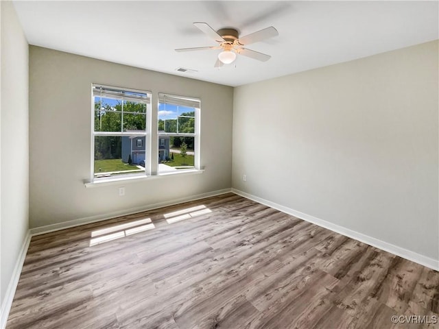 5812 Olas Ct, Richmond, VA 23224 - spare room featuring a ceiling fan, wood finished floors, and baseboards