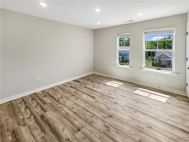 5812 Olas Ct, Richmond, VA 23224 - spare room featuring baseboards, wood finished floors, and recessed lighting