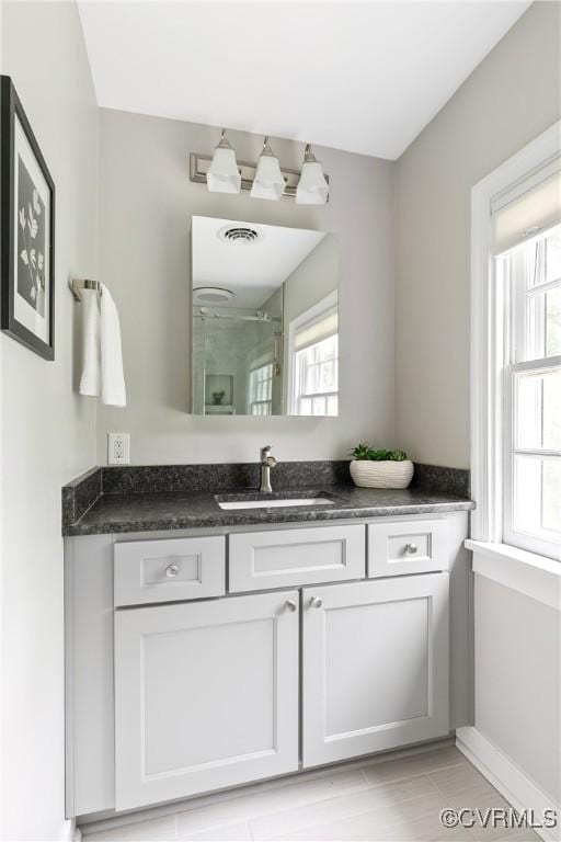 7625 Marilea Rd, Richmond, VA 23225 - full bath featuring vanity, a shower, and baseboards