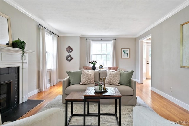 7625 Marilea Rd, Richmond, VA 23225 - living room featuring a fireplace, light wood-style floors, ornamental molding, and baseboards