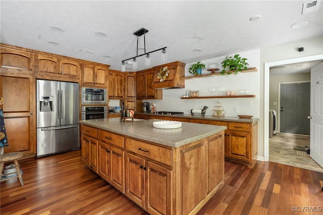 160 Woodland Trl, West Point, VA 23181 - kitchen featuring stainless steel appliances, dark wood-type flooring, brown cabinetry, and open shelves
