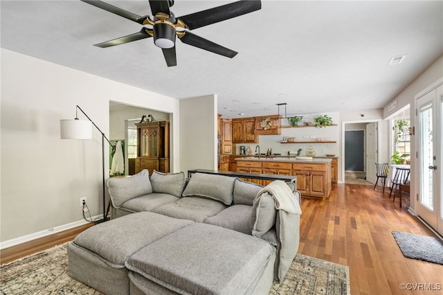 160 Woodland Trl, West Point, VA 23181 - living room with light wood-style floors, ceiling fan, and baseboards
