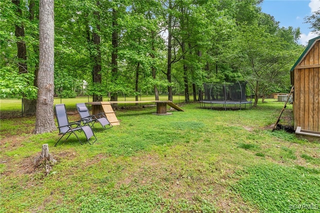 160 Woodland Trl, West Point, VA 23181 - view of green lawn with a trampoline