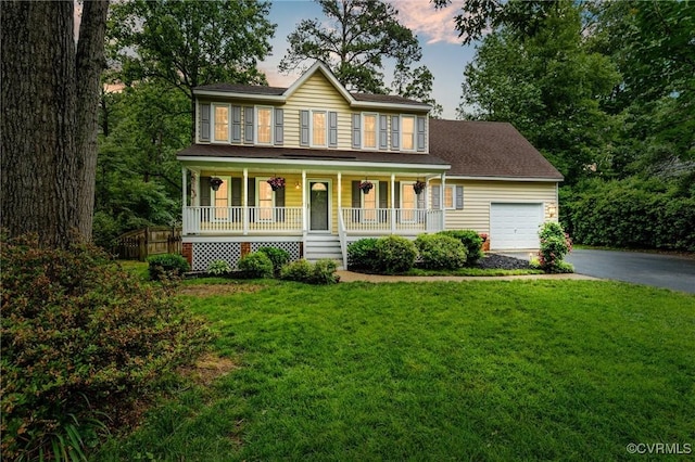 1513 Crawford Wood Dr, Midlothian, VA 23114 - colonial-style house featuring asphalt driveway, a porch, a garage, and a front lawn