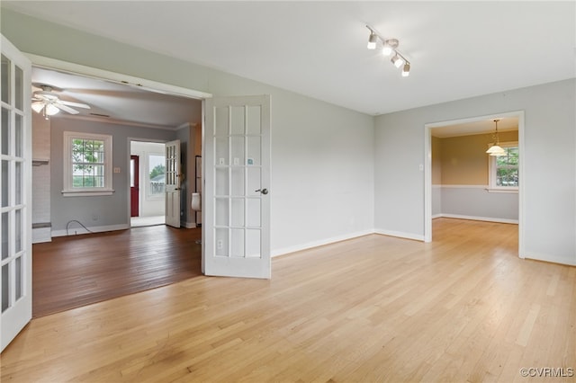 11440 Bienvenue Rd, Rockville, VA 23146 - unfurnished room featuring light wood-type flooring, baseboards, a ceiling fan, and rail lighting